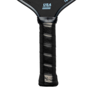 Close-up of a black pickleball paddle grip with USA Pickleball Approved text.