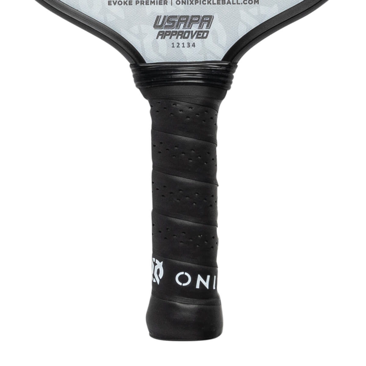 Close-up of a black pickleball paddle grip with perforated texture and white ONIX logo.