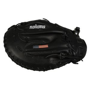 Top-down view of a black first base mitt with nokona branding and an American flag patch.