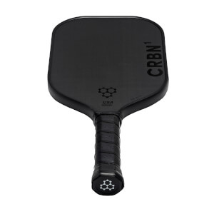 Top-down view of a black pickleball paddle with CRBN¹ branding and a honeycomb logo.