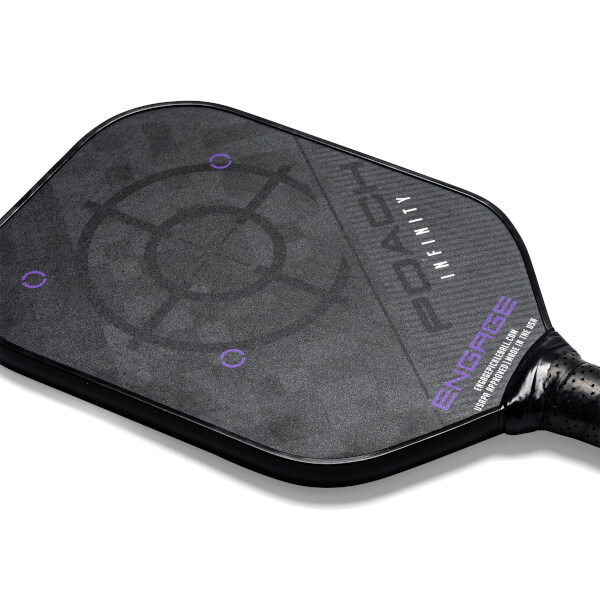 Top-down view of a black pickleball paddle with a target graphic and POACH INFINITY text.