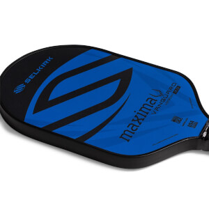 Corner view of a black and blue pickleball paddle with a large S graphic, Selkirk text, and Maxima VANGUARD 2.0 text.