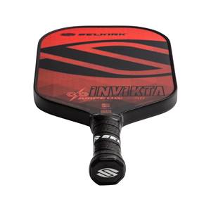 Top-down view of a red and black pickleball paddle with INVIKTA and SELKIRK branding.