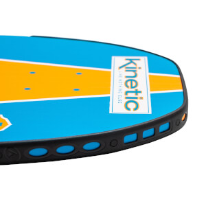 Corner view of a blue and orange pickleball paddle with Kinetic branding and a black perforated edge.