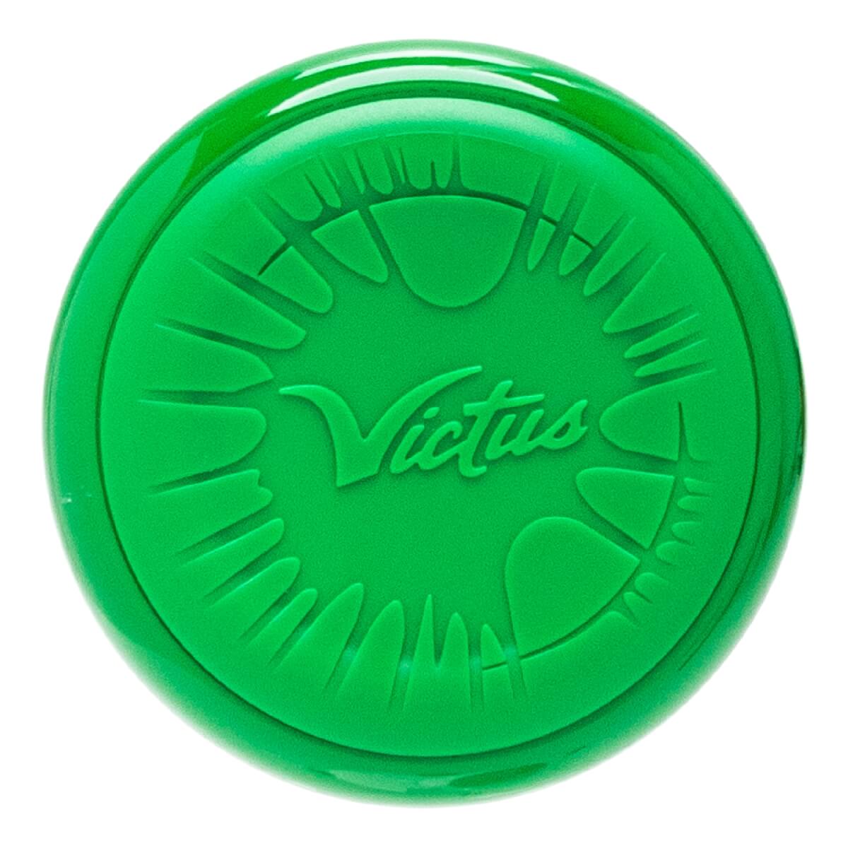Top-down view of a green baseball bat end cap with embossed Victus logo and sunburst design.