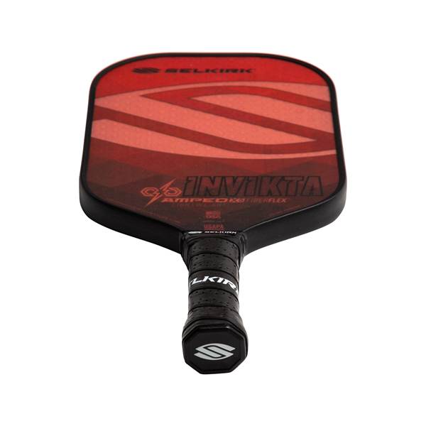 Top-down view of a red and black pickleball paddle with INVIKTA and SELKIRK branding.