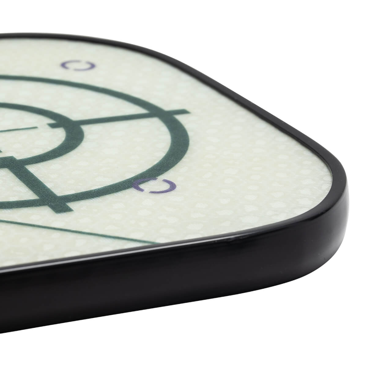 Corner view of a white pickleball paddle with a dark green target design and purple accents.