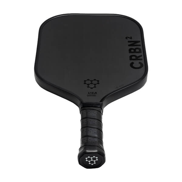 Top-down view of a black pickleball paddle with CRBN² branding and a honeycomb logo.