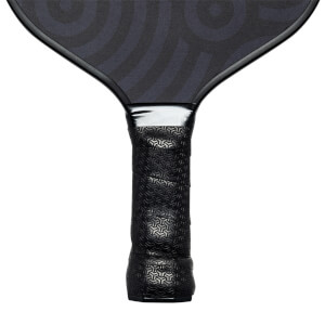 Close-up of a black pickleball paddle grip with a geometric pattern and silver neck.