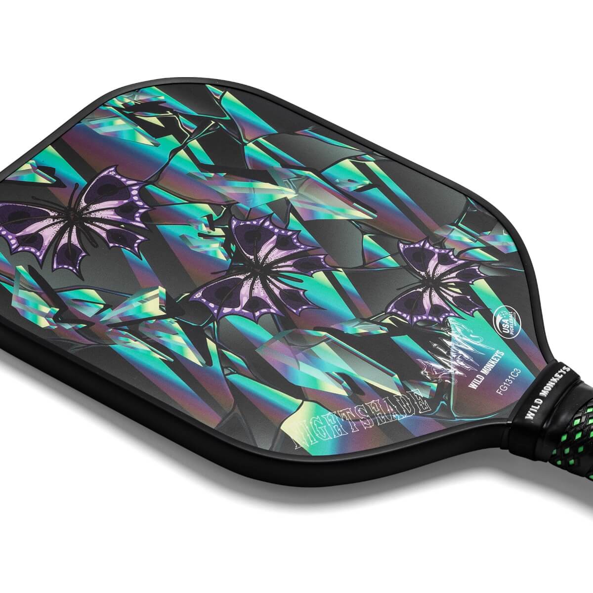 Corner view of a black pickleball paddle with holographic butterfly and crystal graphics, and NIGHTSHADE text.