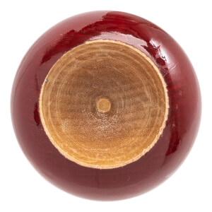Top-down view of a dark red baseball bat with a cupped natural wood barrel end showing wood grain.