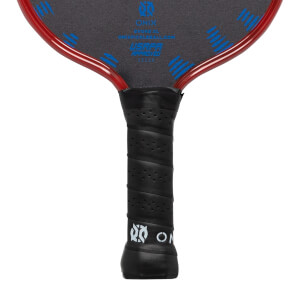 Close-up of a black pickleball paddle grip with perforations and white ONIX logo.