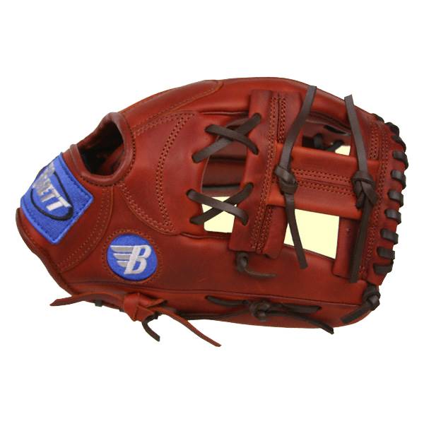 Side view of a brown baseball glove with a blue BRETT patch and a white B logo.