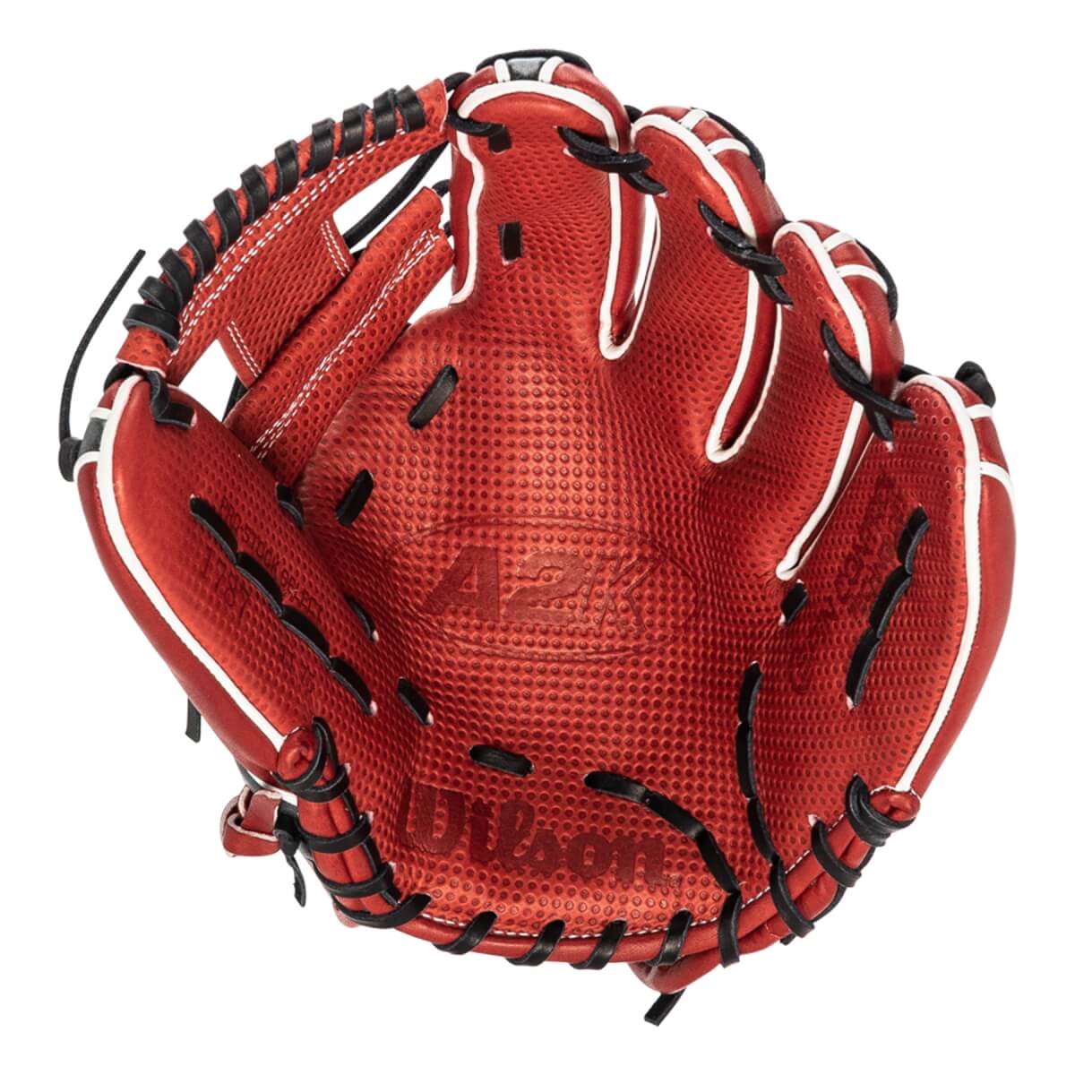 Top-down view of a red baseball glove with white piping, black lacing, and A2K Wilson branding.
