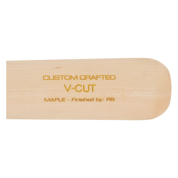 Close-up of a natural wood baseball bat with CUSTOM CRAFTED V-CUT MAPLE - Finished by: RS printed in gold.