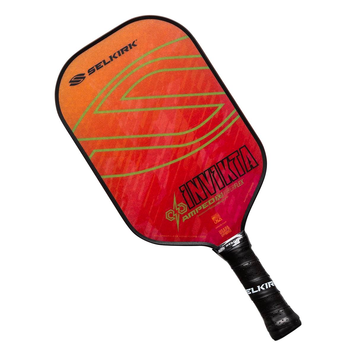 Front view of a red and orange pickleball paddle with green lines, INV IKTA text, and a black grip.