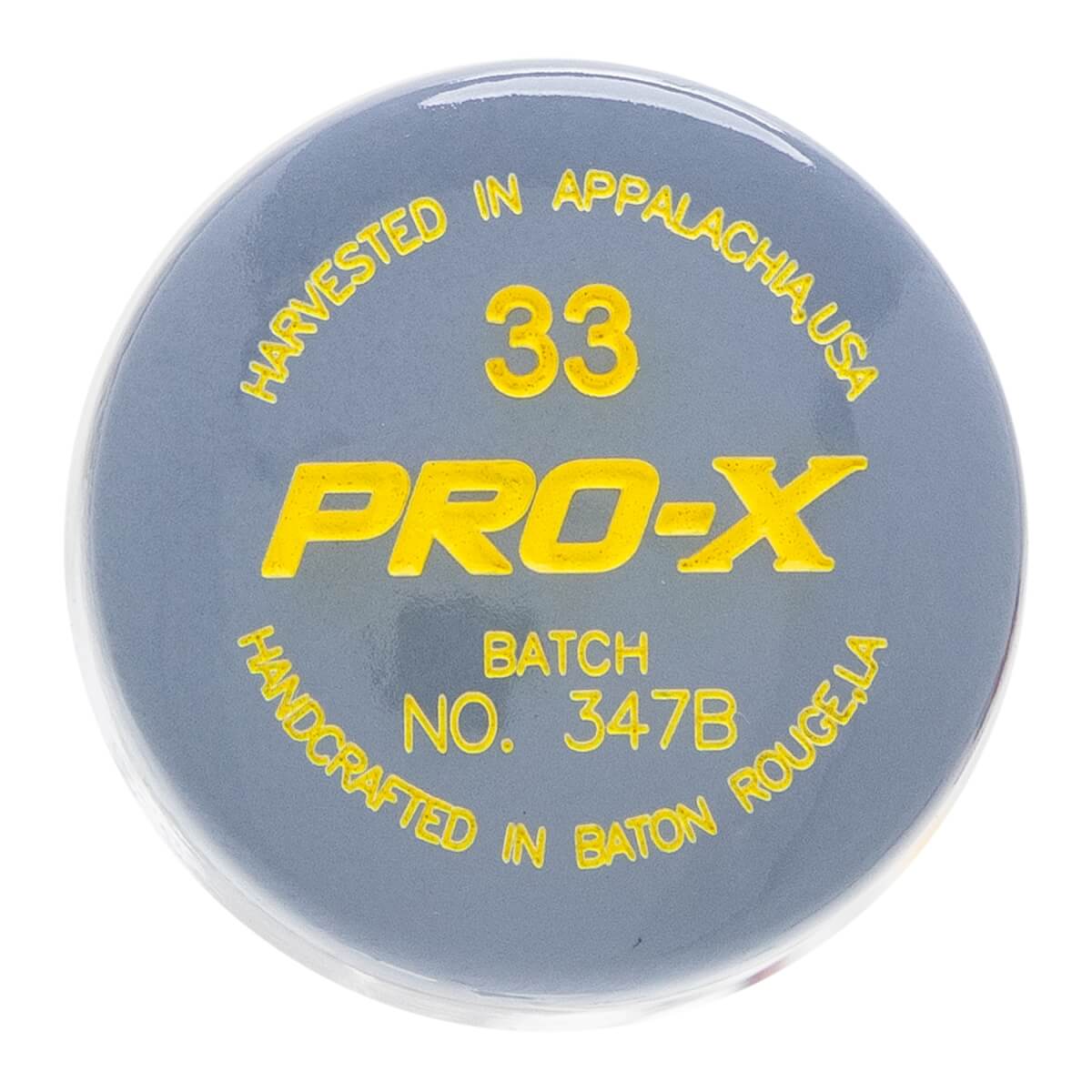 Top-down view of a gray baseball bat puck with yellow PRO-X text, 33, and HARVESTED IN APPALACHIA, USA.