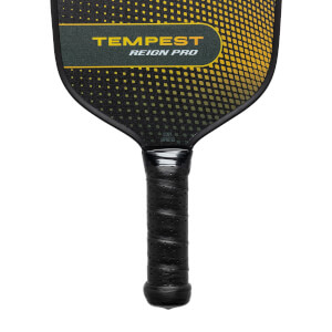 Top-down view of a black pickleball paddle with yellow dot pattern and TEMPEST REIGN PRO text.