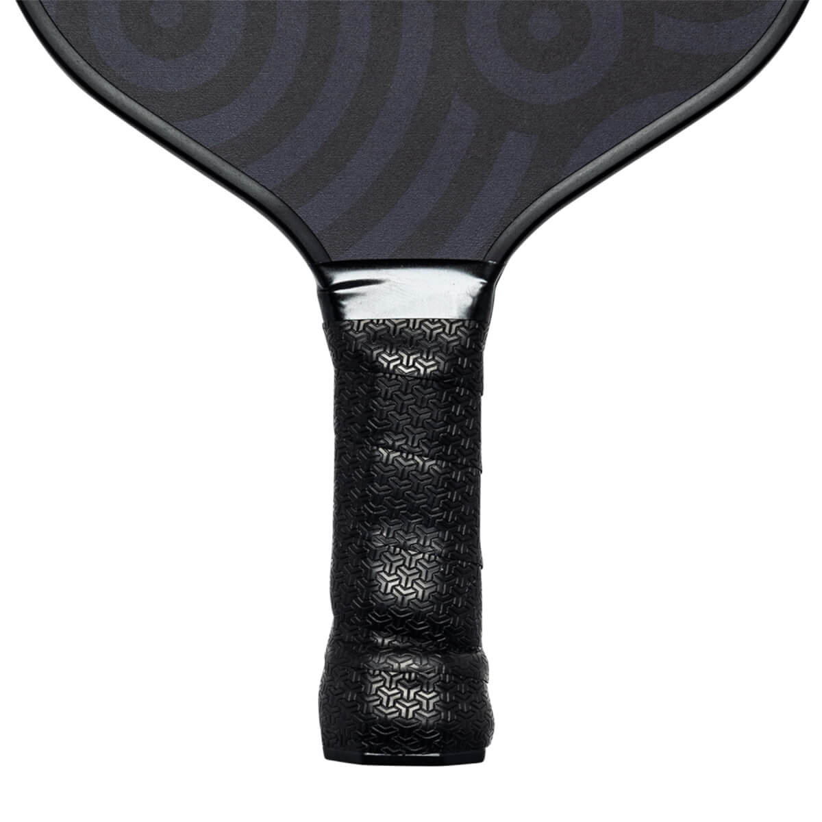 Close-up of a black pickleball paddle grip with a geometric pattern and silver neck.