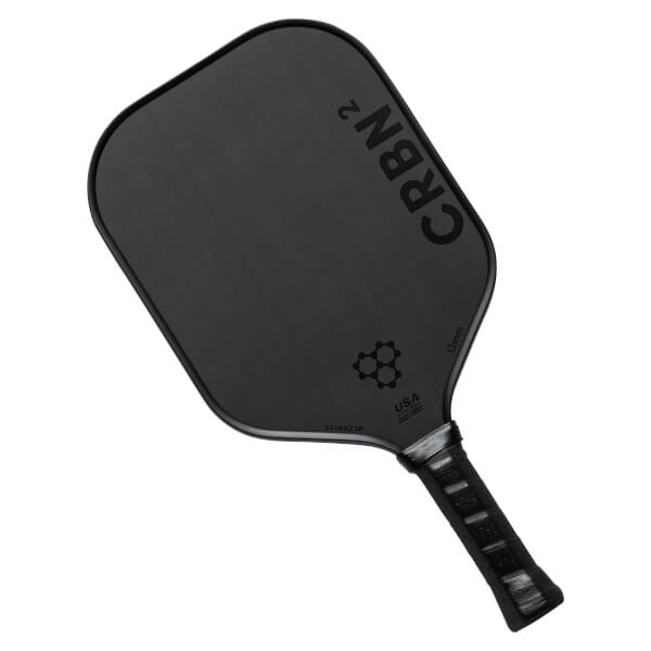 Top-down view of a black pickleball paddle with CRBN² branding, honeycomb logo, and USA text.