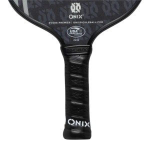Close-up of a black pickleball paddle grip with ONIX branding and USA Pickleball Approved logo.