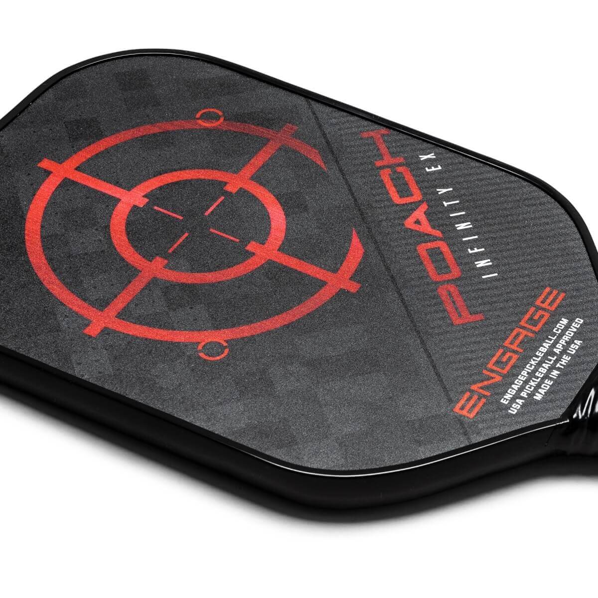 Corner view of a black pickleball paddle with a red target design and POACH INFINITY EX text.