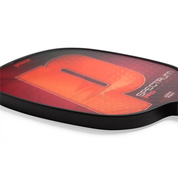 Side view of a red and orange pickleball paddle with a large R graphic and SPECTRUM PRO text.