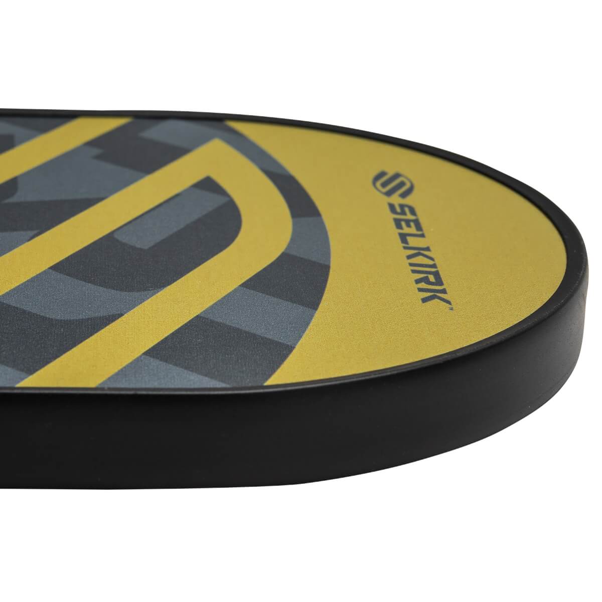 Corner view of a yellow pickleball paddle with a black edge and a grey and yellow geometric pattern.