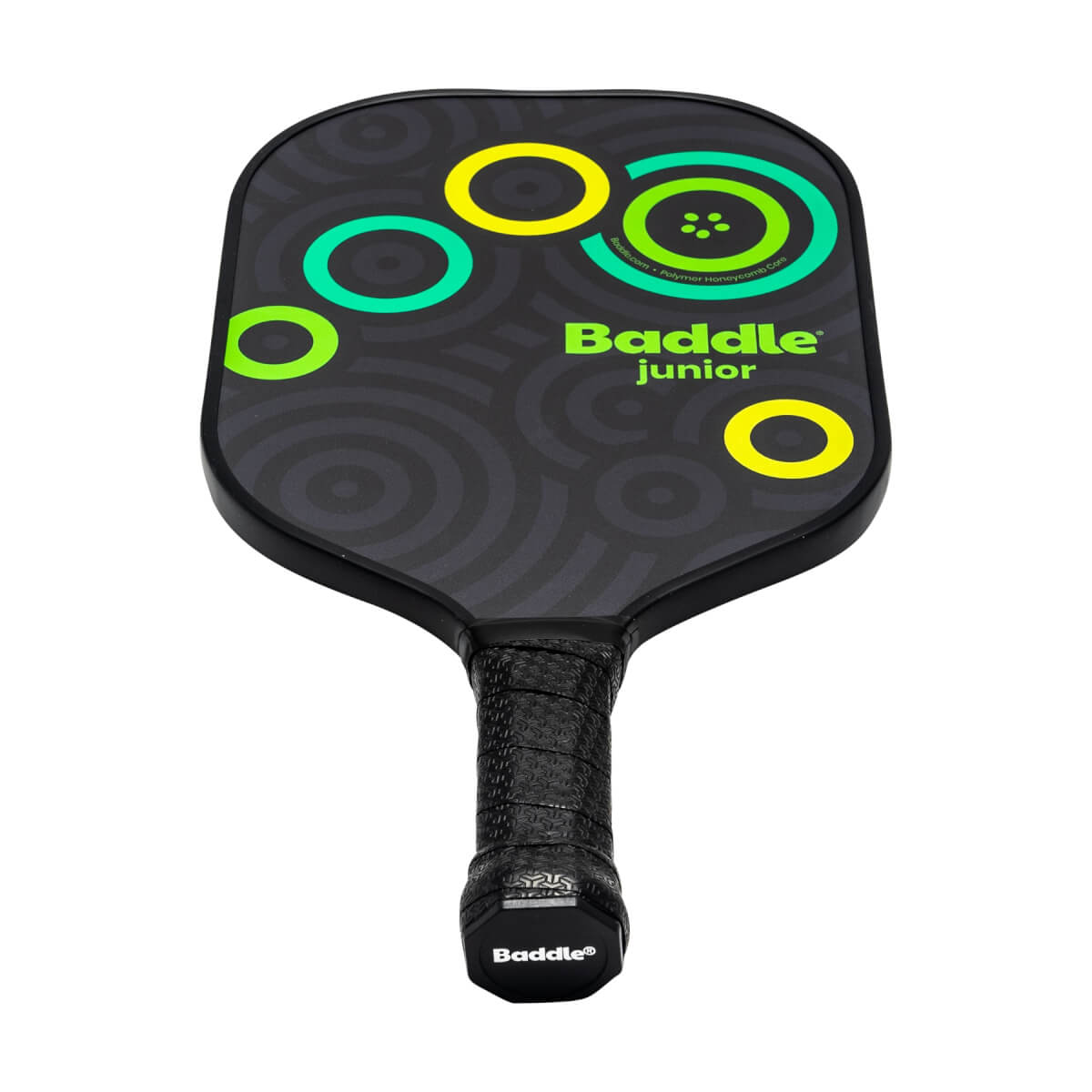 Front view of a black Baddle Junior pickleball paddle with green and yellow circles and concentric pattern.