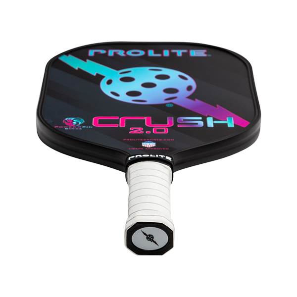 Top-down view of a black PROLITE Crush 2.0 pickleball paddle with a white grip and a graphic of a ball with arrows.