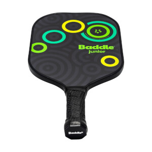 Front view of a black Baddle Junior pickleball paddle with green and yellow circles and concentric pattern.