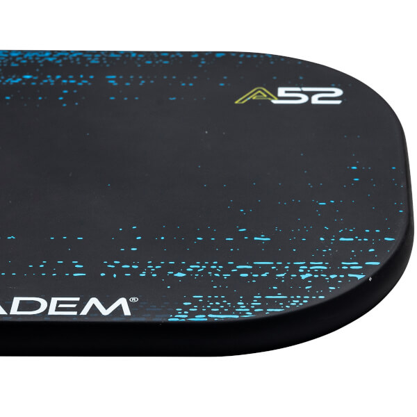 Corner view of a black pickleball paddle with blue speckle design and A52 branding.