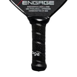 Close-up of a black pickleball paddle grip with perforated texture and Engage text.