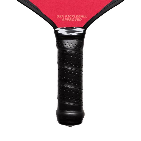 Close-up of a black pickleball paddle grip with perforated texture and USA PICKLEBALL APPROVED text.