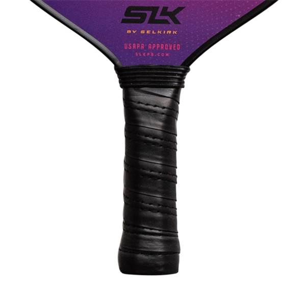 Close-up of a black pickleball paddle grip with USAPA APPROVED and SLKPB.COM visible.