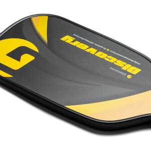 Corner view of a black GAMMA pickleball paddle with yellow Discovery text and a large yellow G graphic.