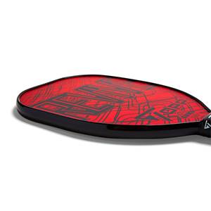 Side view of a red pickleball paddle with black graphic design and black edge.
