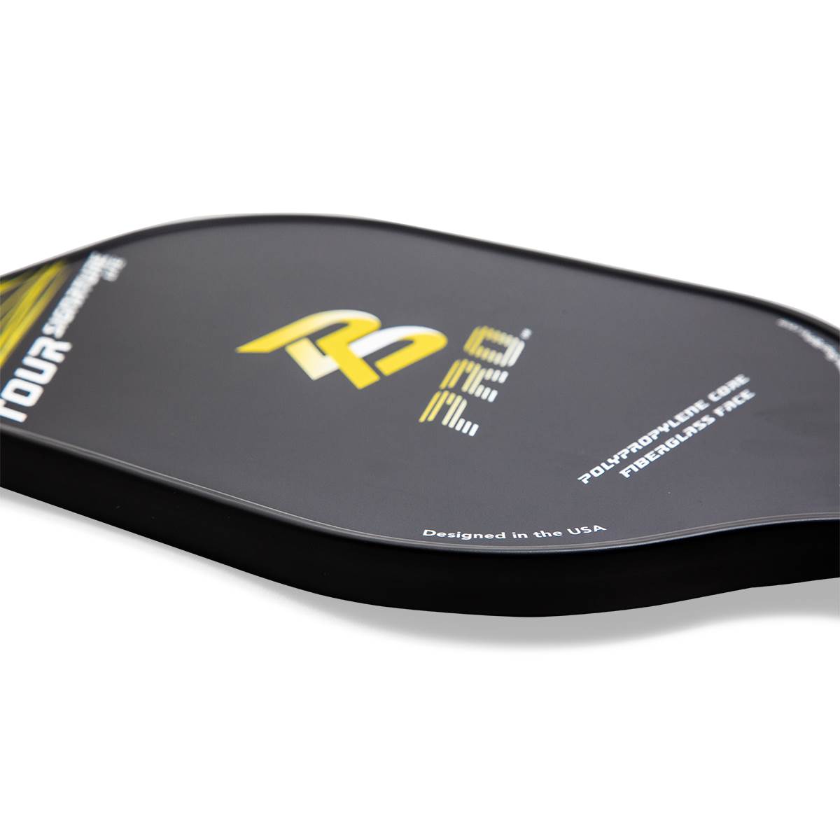 Side view of a black pickleball paddle with yellow PB PRO logo and Designed in the USA text.