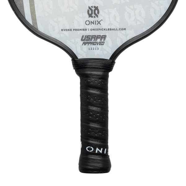 Close-up of a black pickleball paddle grip with perforated texture and ONIX branding.