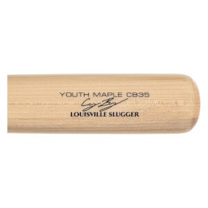 Close-up of a natural wood baseball bat with YOUTH MAPLE CB35, Cody Bellingers signature, and LOUISVILLE SLUGGER branding.