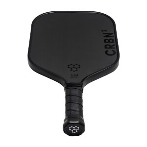 Top-down view of a black pickleball paddle with CRBN² branding and a honeycomb logo.
