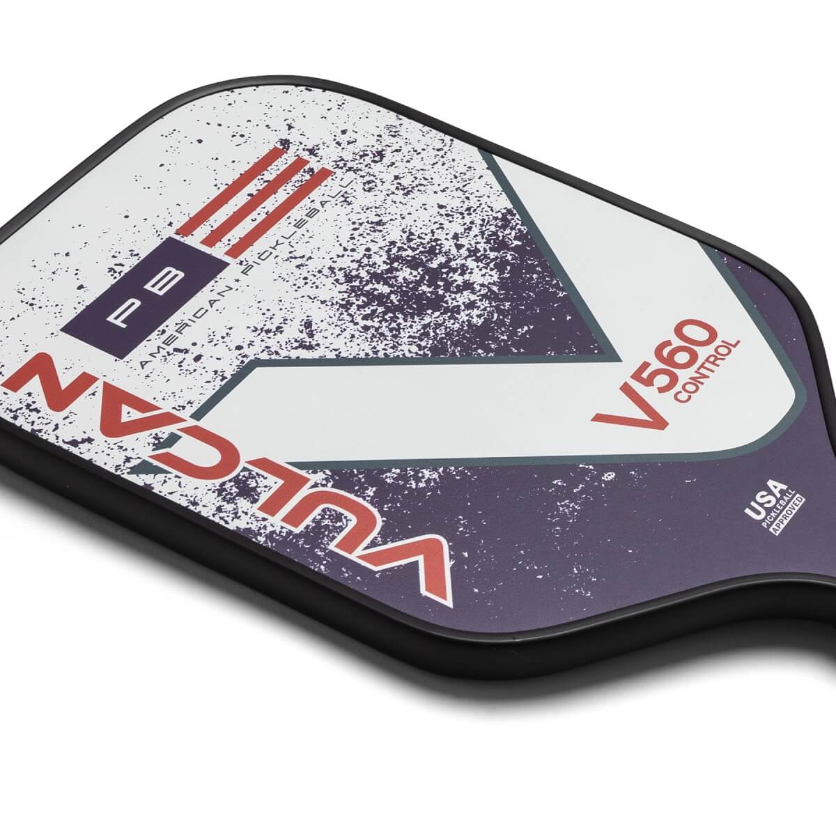 Corner view of a white, purple, and red Vulcan V560 Control pickleball paddle with PB AMERICAN PICKLEBALL text and a USA PICKLEBALL APPROVED stamp.