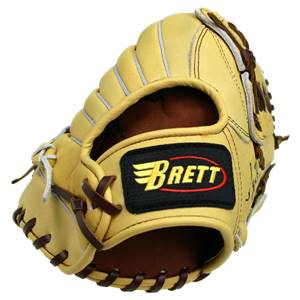 Side view of a tan baseball glove with a black and yellow Brett logo and brown lacing.