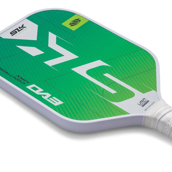 Corner view of a green pickleball paddle with white SLK EVO MAX branding and a textured white grip.
