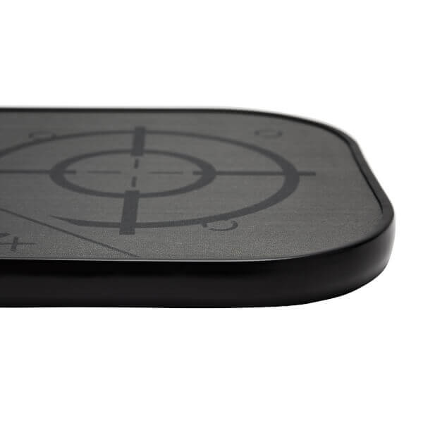 Side view of a black pickleball paddle with a target graphic and textured surface.
