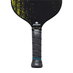 Close-up of a black pickleball paddle with yellow speckles, Diadem logo, and gray grip with blue text.