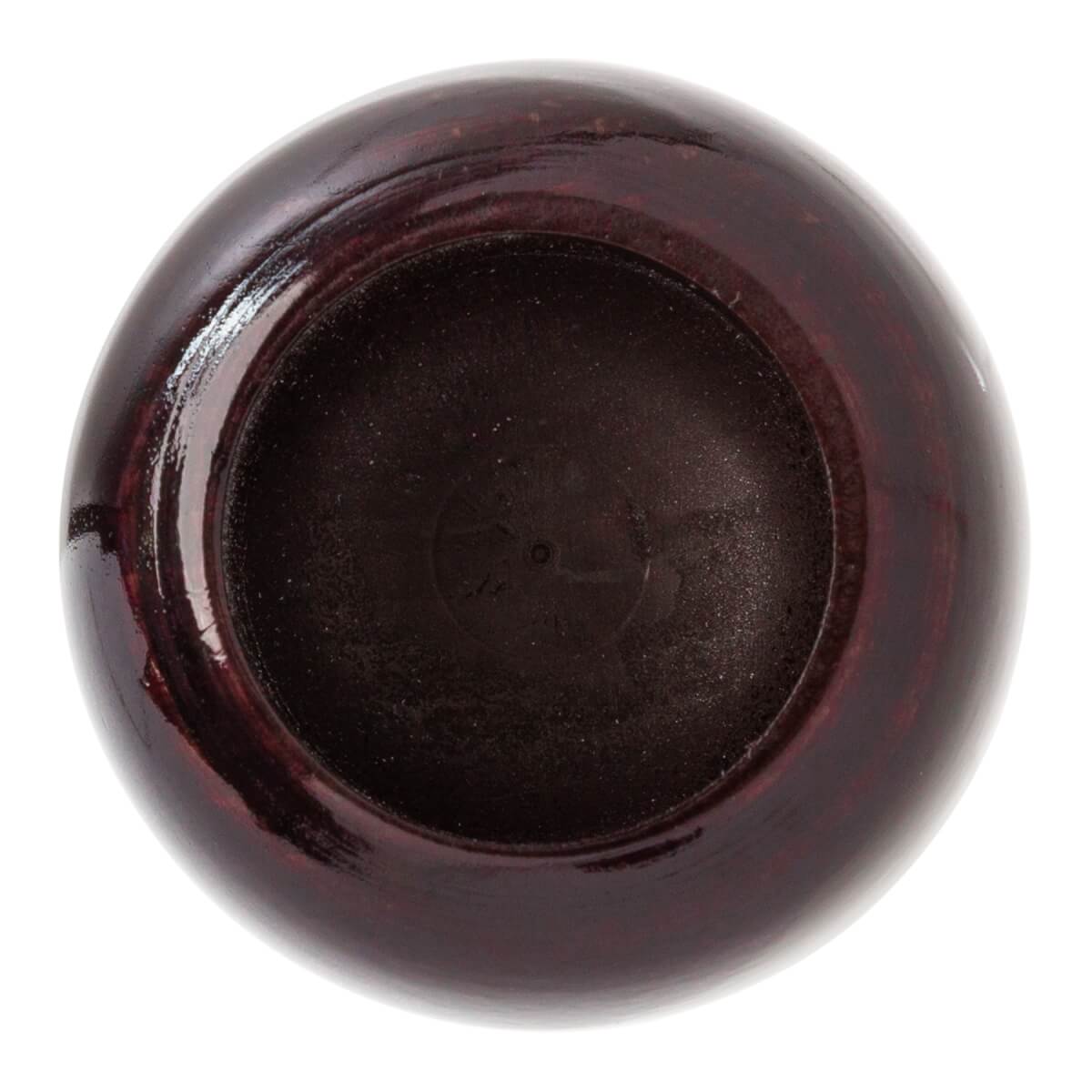 Top-down view of a dark brown wood baseball bat with a concave end and faint circular markings.