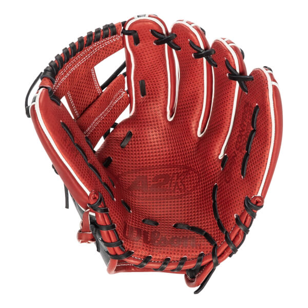 Palm view of a red baseball glove with black lacing and white trim, showing A2K and Wilson branding.