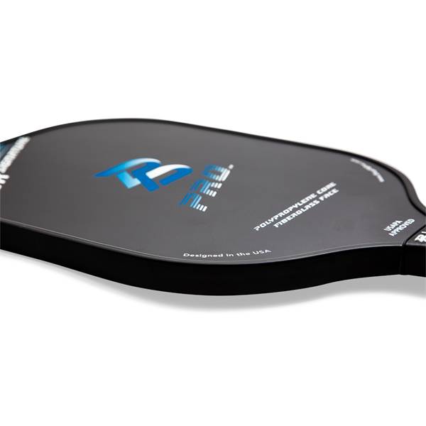 Side view of a black pickleball paddle with blue PB PRO logo, POLYPROPYLENE CORE FIBERGLASS FACE text, and USAPA APPROVED stamp.