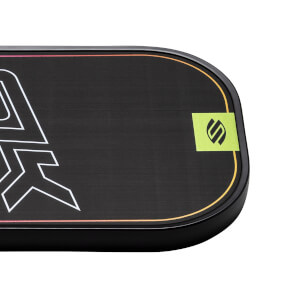 Corner view of a black pickleball paddle with white graphic and green SLK logo.